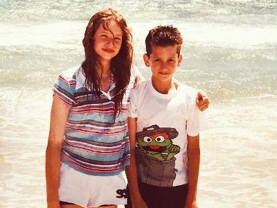 Kassandra Clementi is side hugging Cody Clementi as they are posing in front of the sea.